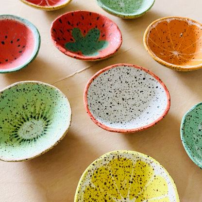 Colorful ceramic bowls on a wooden surface